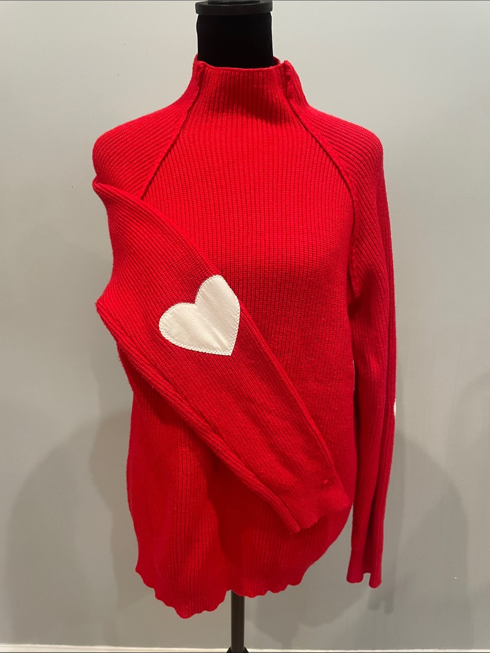 Red High neck sweater with white heart patches on elbow